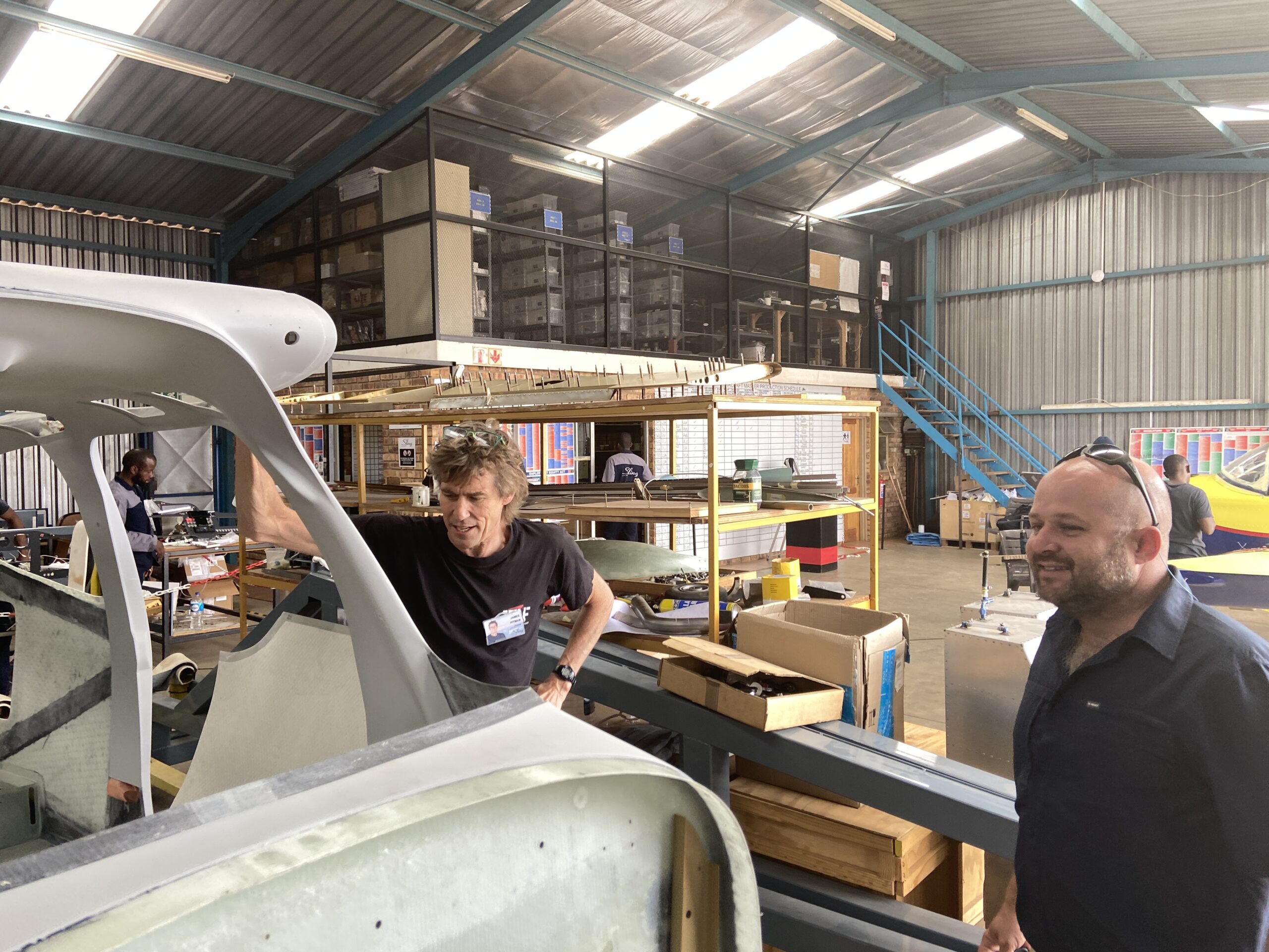 Guts and James inspect a Sling Fuselage