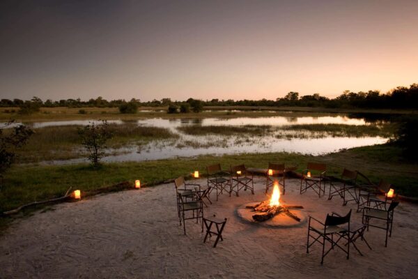 Great Plains Selinda Pioneers Camp Bonfire Dining Outdoor dining experience at Okavango Explorers Camp.
