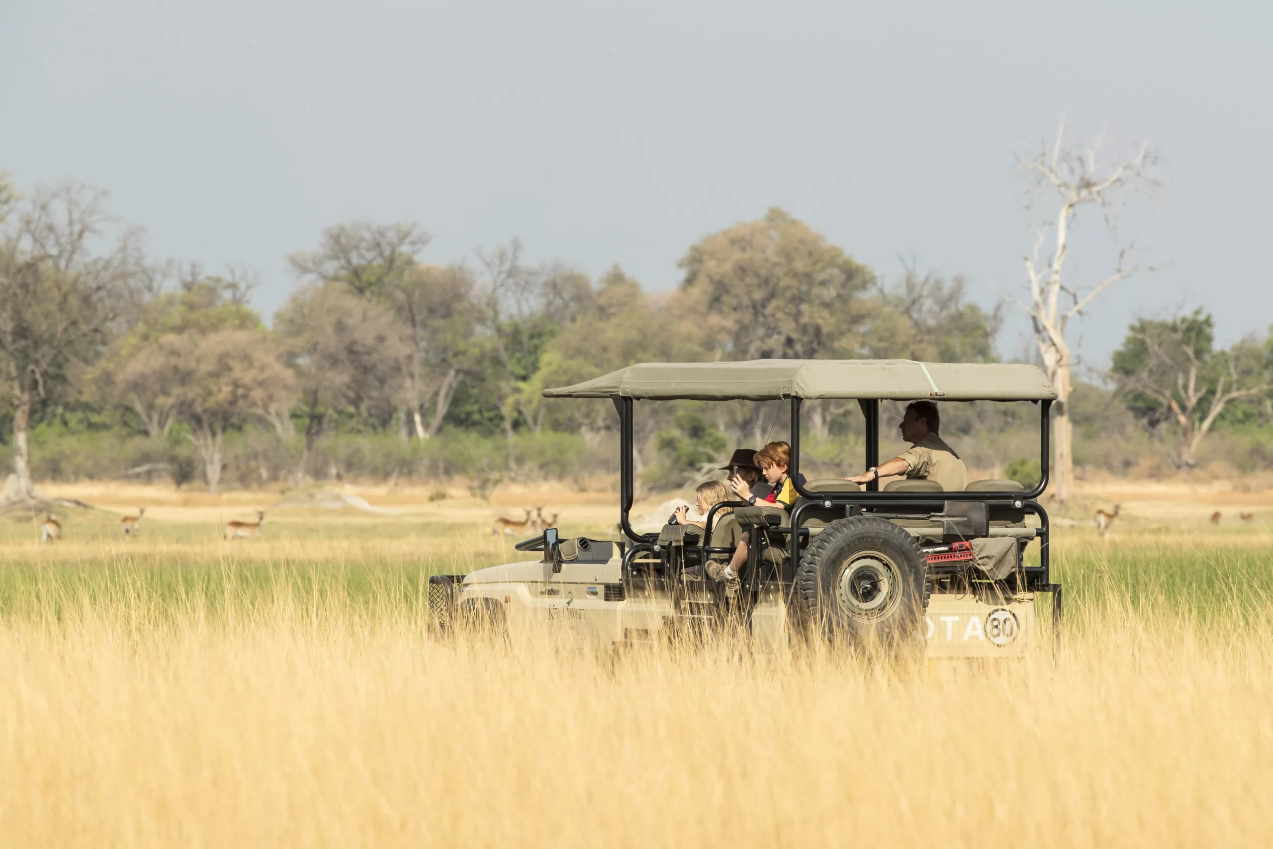 Okavango Delta game drive family pangolin photo safaris Driving through the Okavango Delta