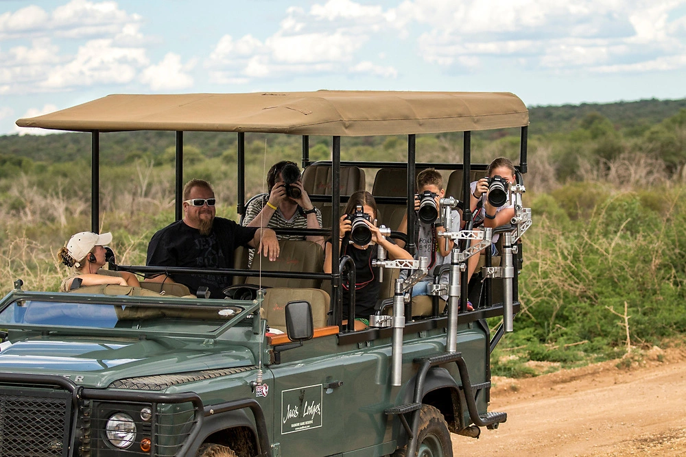 Guests enjoying a game drive from the safari lodge in Madikwe Game Reserve